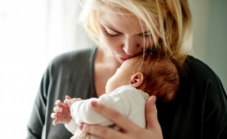 Your Skin - Mother kissing baby Your Skin - Mother kissing baby