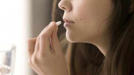 Woman taking medication